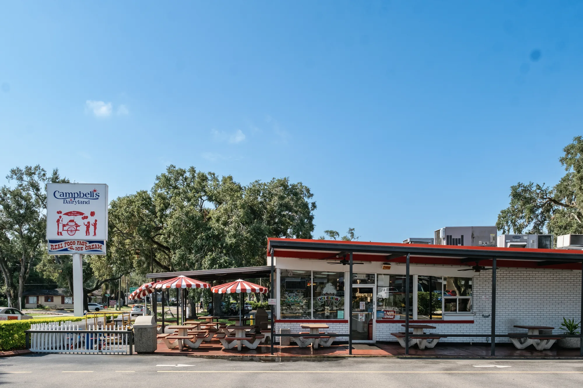 Campbell's Dairyland storefront, patio, and roadside sign in Brandon
