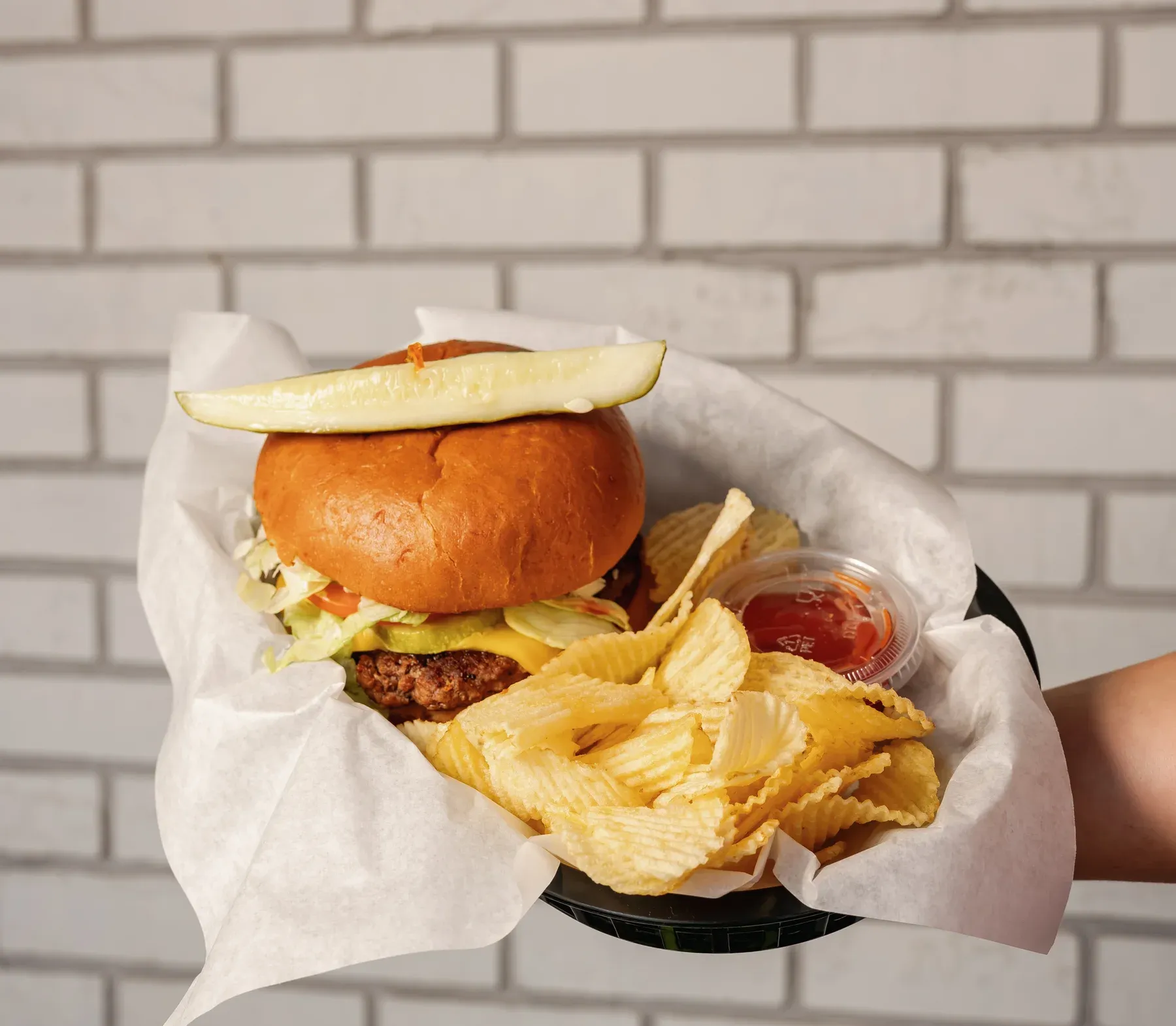 Classic cheeseburger and chips at Campbell's Dairyland